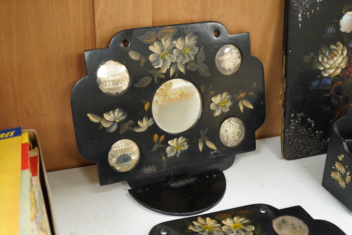 A collection of Victorian papier maché to include an inkstand, a pair of Victorian mirrored wall brackets and a swing handled dish, largest 30cm high